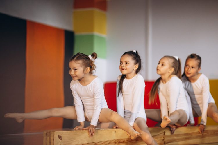 group-girls-exercising-gymnastic-school-scaled